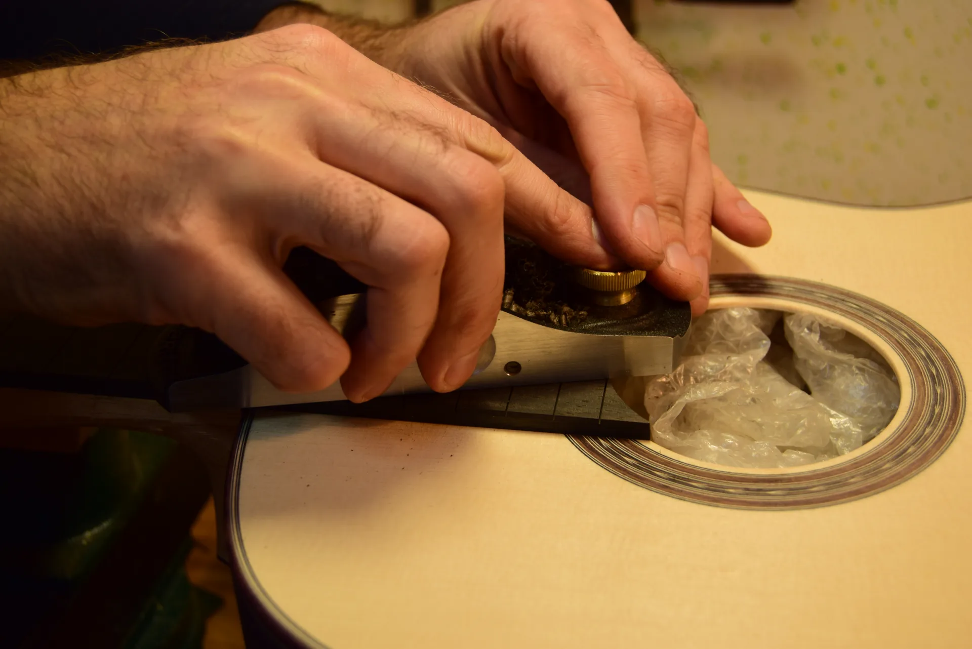 A slight slope on the bass side lowers the future saddle height — 1mm difference between first and sixth strings