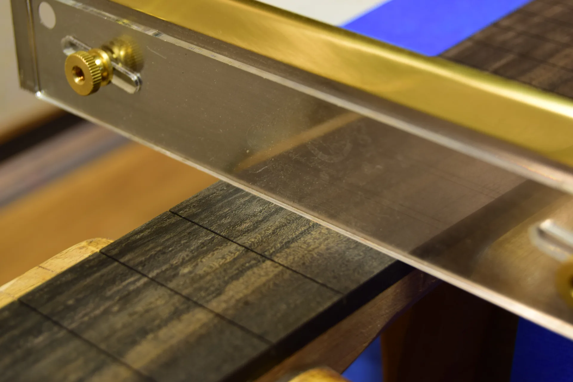 Deepening fret slots with a special saw with adjustable cutting depth