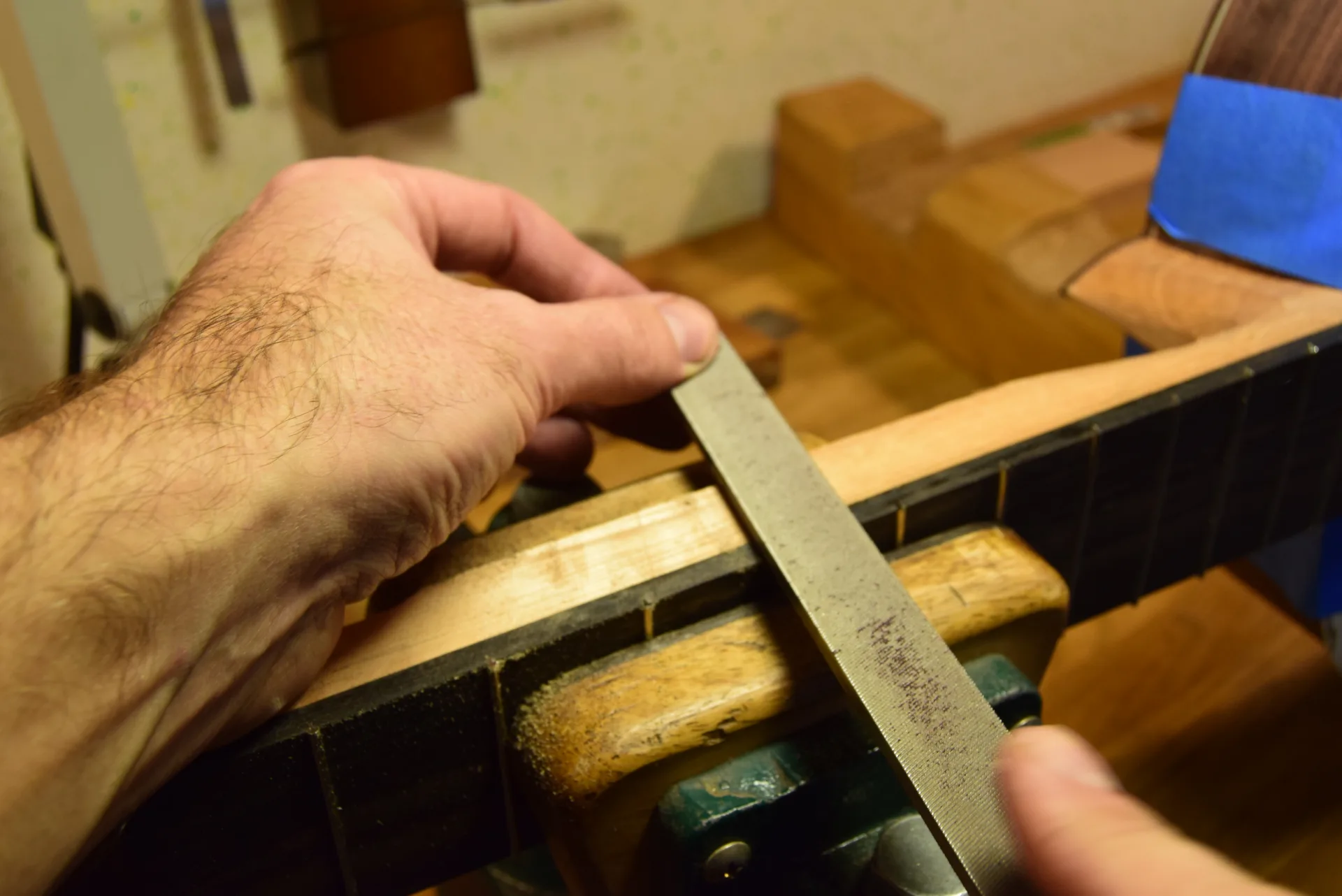 Trimming fret ends flush with a file
