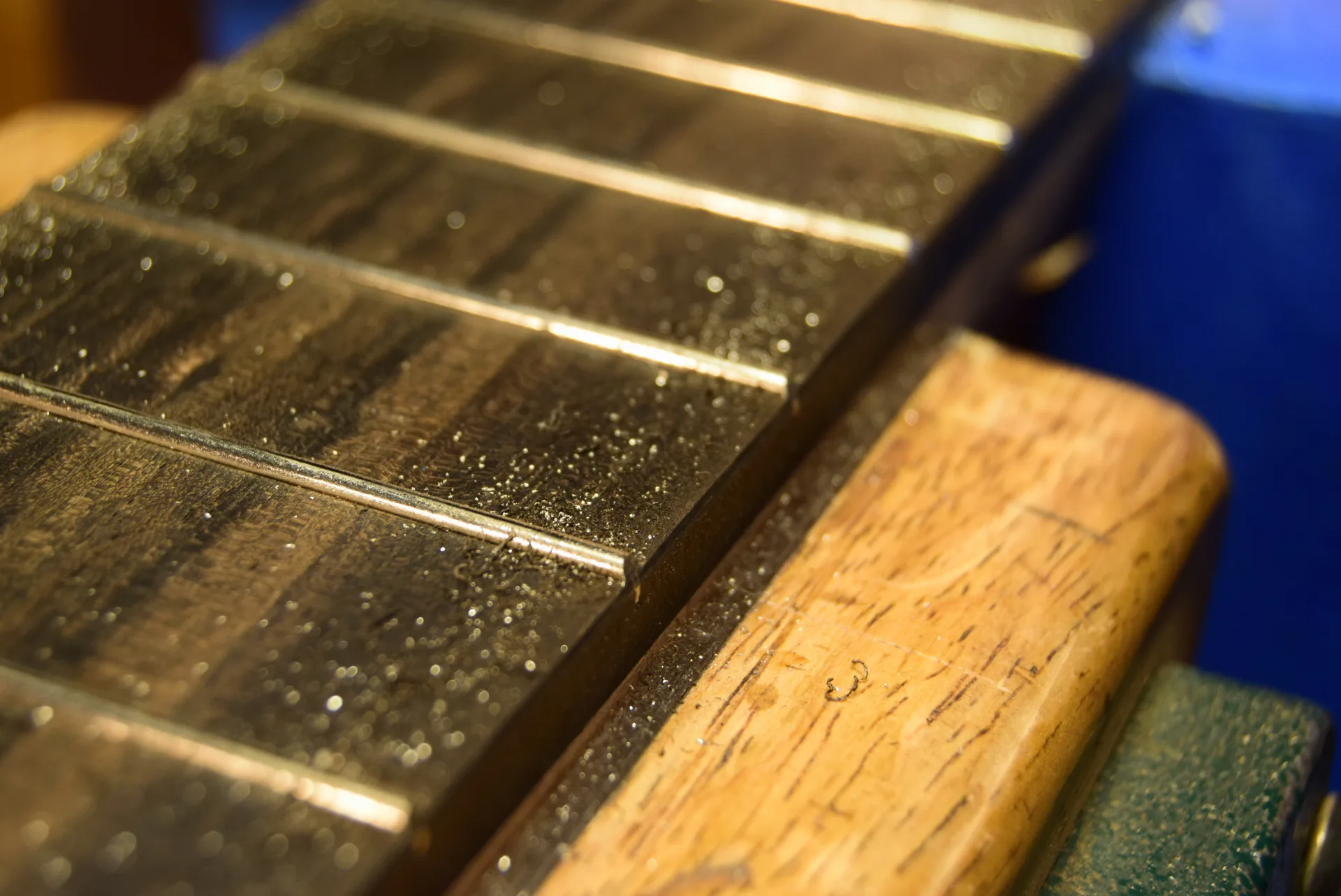 Softening sharp fret edges with sandpaper
