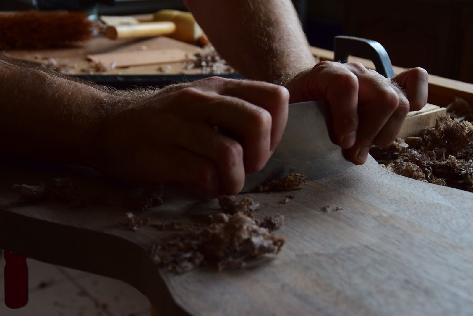 Scraping the solera cavity to the desired curve