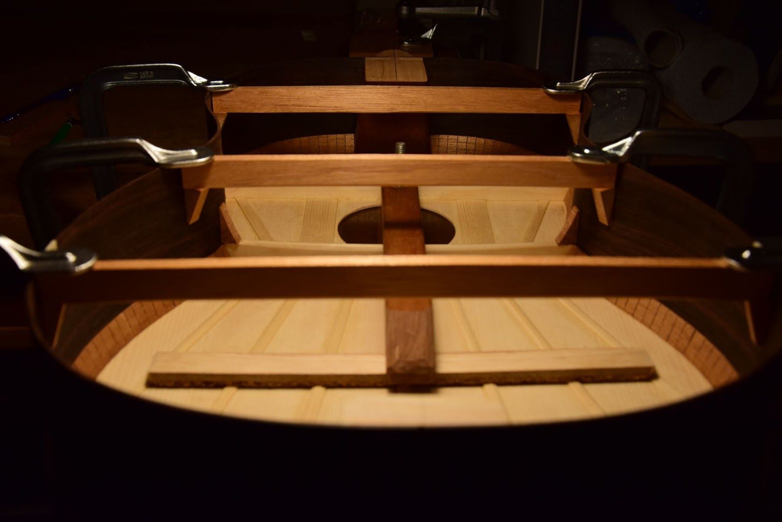 Hands placing the back plate during body closing