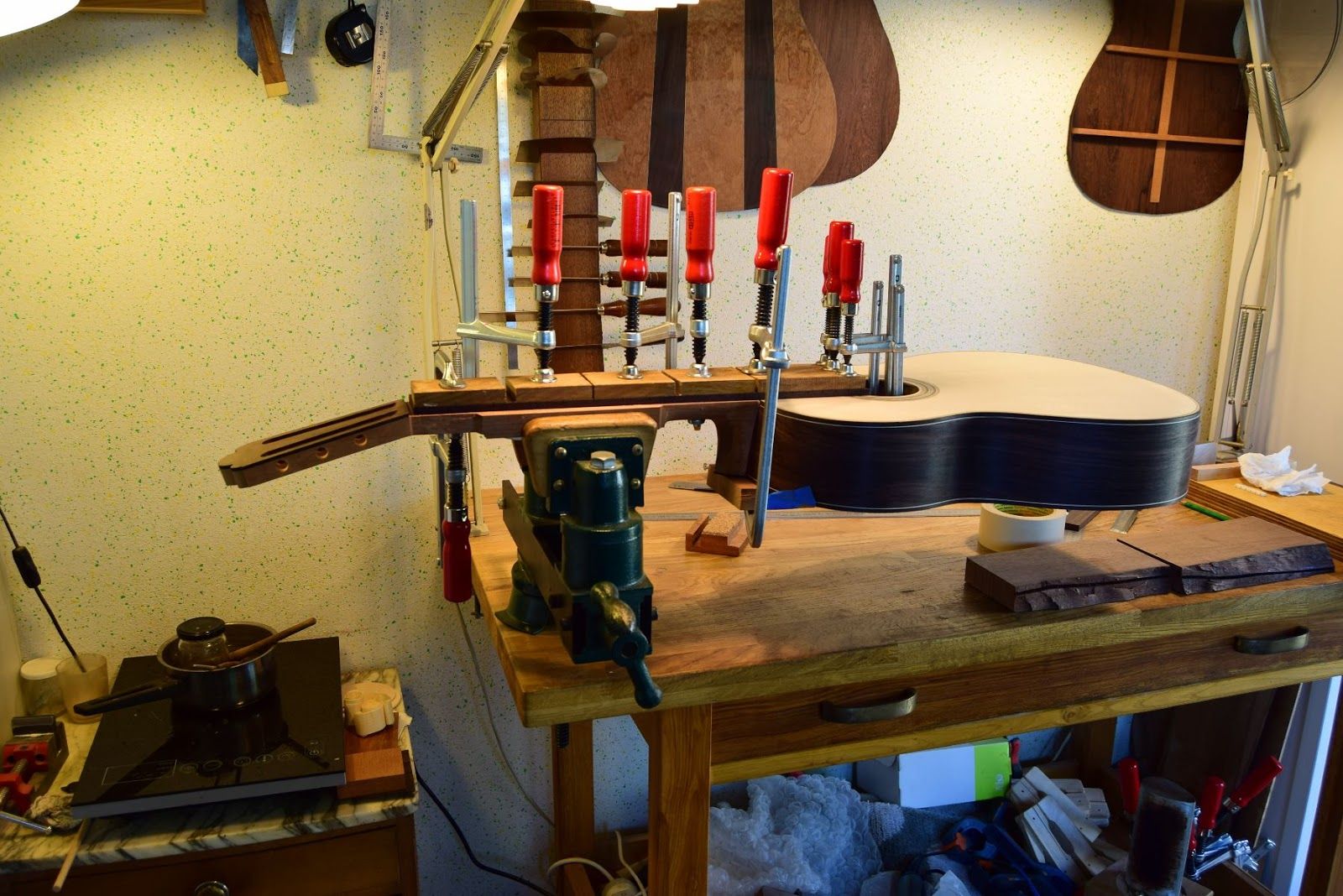 Bridge gluing with string and wooden wedges — traditional method