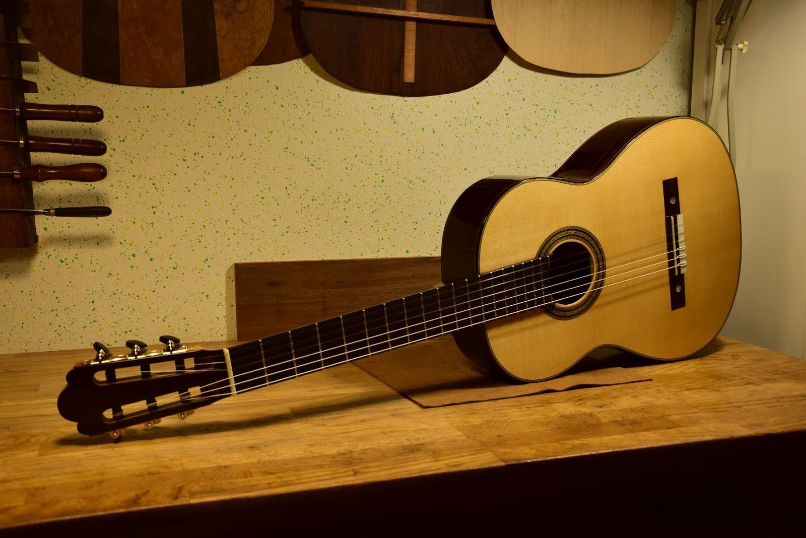 Side detail after finishing — binding and French polish visible