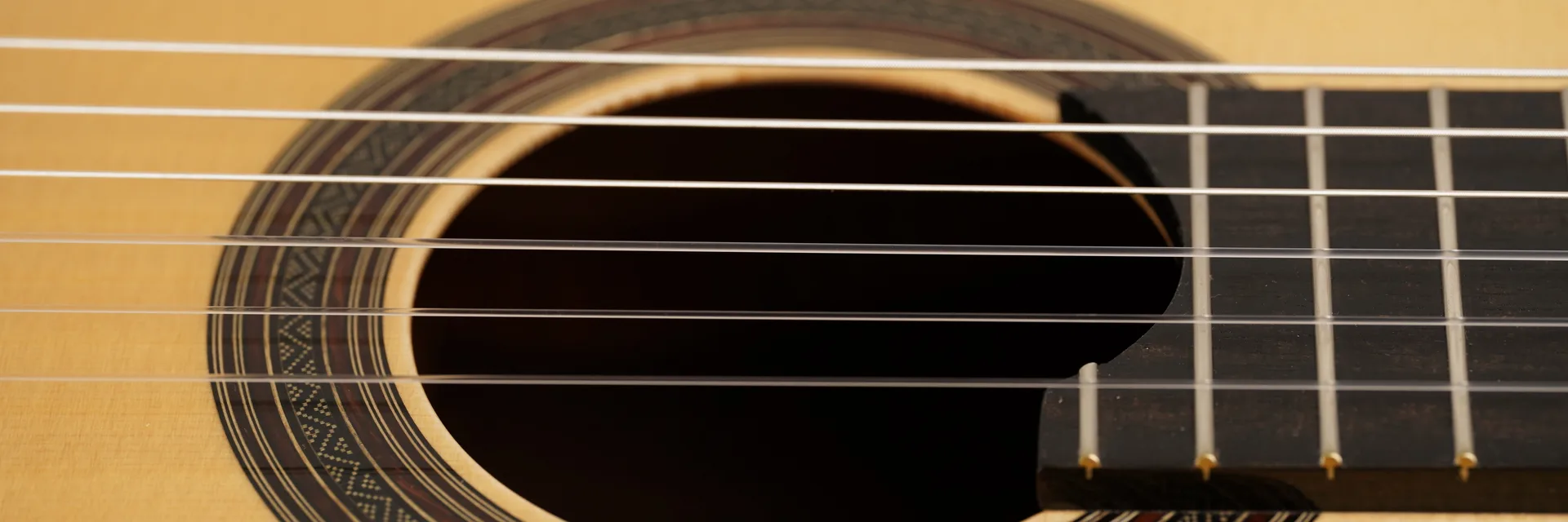 Guitar soundhole, rosette and strings — Soroka Luthier